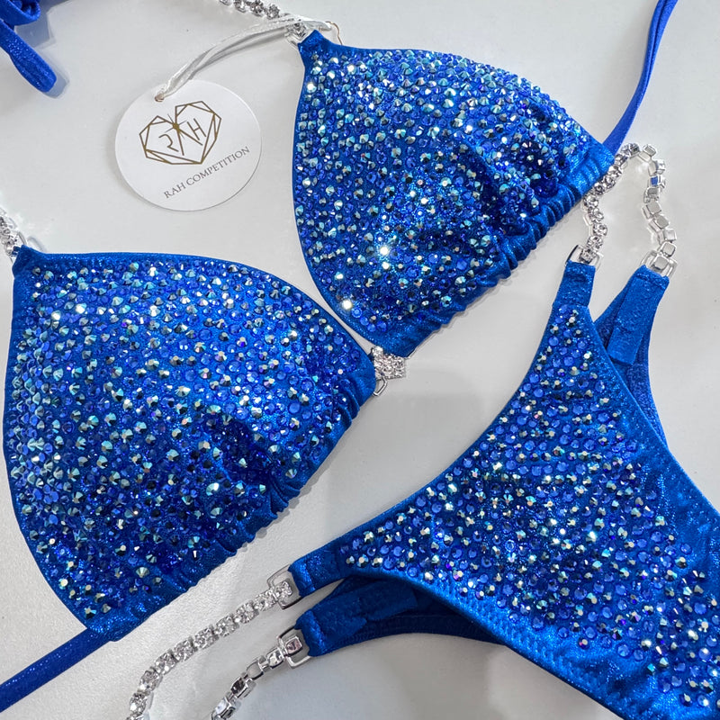 Blue bikini set with rhinestone details on a white background
